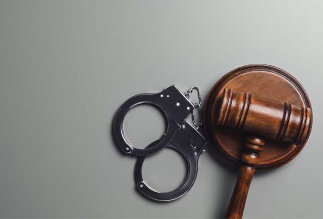SLI - Judge`s gavel and handcuffs on grey background,